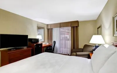 Guest room in Holiday Inn Laval Montreal, featuring workspace desk and chair.