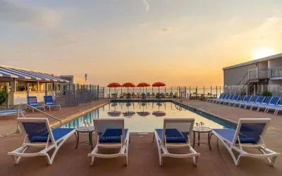 Stunning outdoor pool at sunset at Sea Crest Beach Hotel.