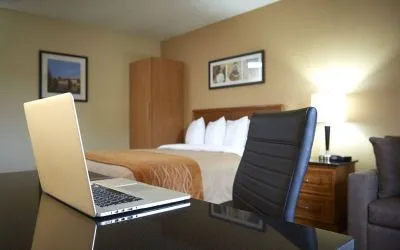 An in-room workspace desk and chair at Comfort Inn Fredericton.