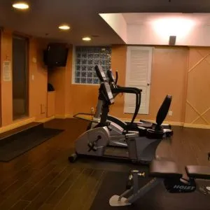 The hotel fitness center has exercise machines and a television.