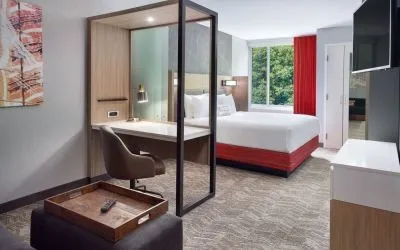 Spacious king room with TV and business desk at SpringHill Suites Atlanta Northwest.