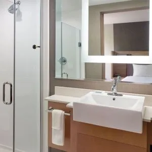 Private guest bathroom with shower at SpringHill Suites Atlanta Northwest.