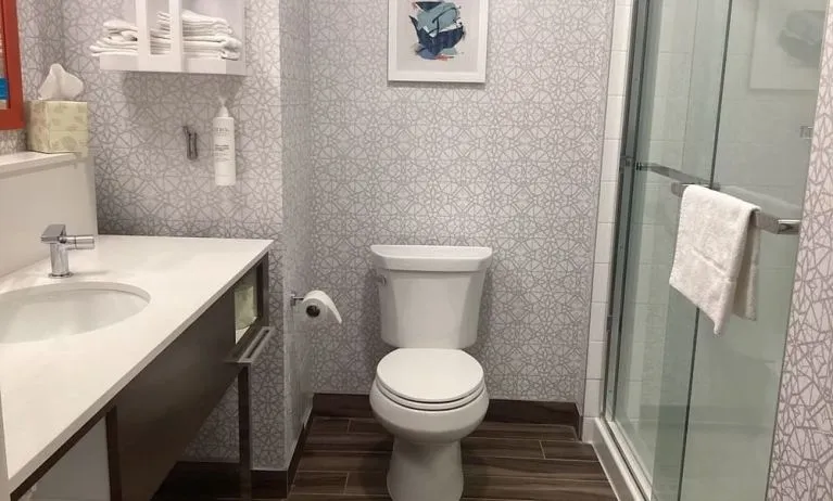 Private guest bathroom with shower at Hampton Inn By Hilton Port Hope.