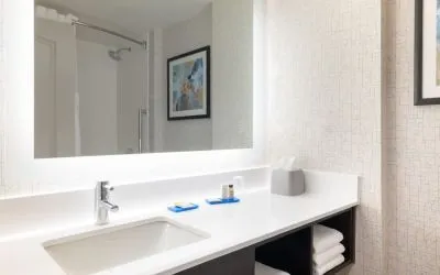 Guest bathroom with shower at Holiday Inn Express & Suites Boston-Cambridge.
