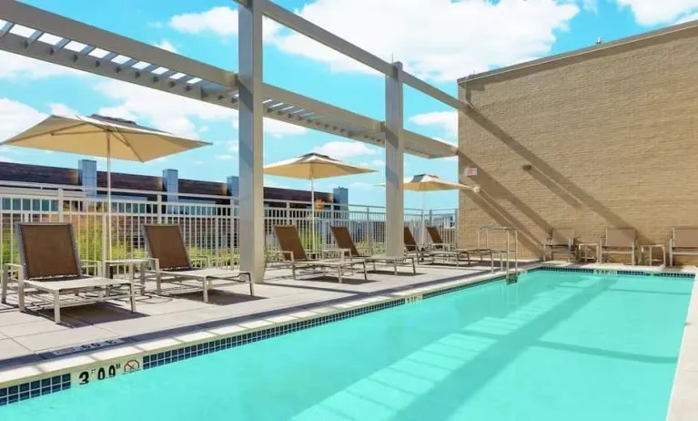 Lovely outdoor pool with pool chairs at Hilton Garden Inn Washington DC / Georgetown Area.
