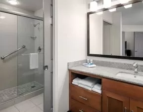 Private guest bathroom with shower at Hyatt House Scottsdale.