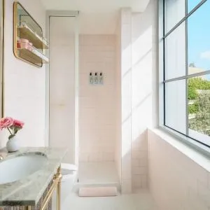 Guest bathroom with shower at The Goodtime Hotel.