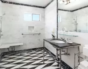 Guest bathroom with shower at Maison 140 Beverly Hills.