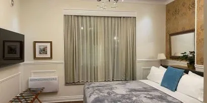 Day use room with TV and air conditioning at Parc Suites Hotel.
