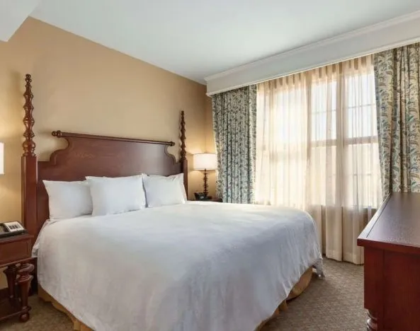 Delux king room with TV at Embassy Suites By Hilton Savannah.