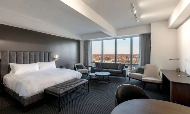 Day use room with sofa, work desk and dining table at Hotel Chauncey.
