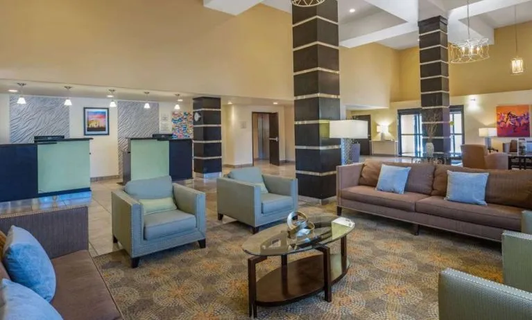 Lobby and coworking lounge at La Quinta Inn & Suites Tucson Reid Park.