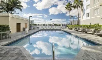 Refreshing outdoor pool at Homewood Suites By Hilton Miami Airport-Blue Lagoon.