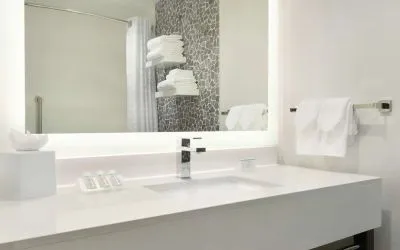 Guest bathroom with shower at Hilton Garden Inn Calgary Downtown.