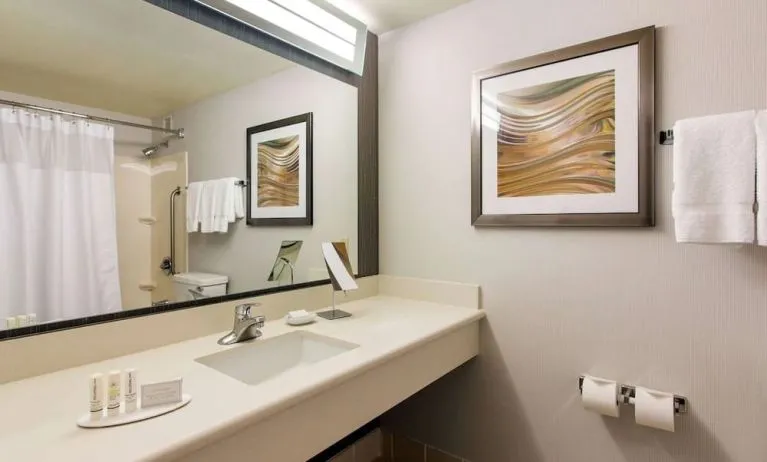 Guest bathroom with shower at Sonesta Emeryville - San Francisco Bay Bridge.