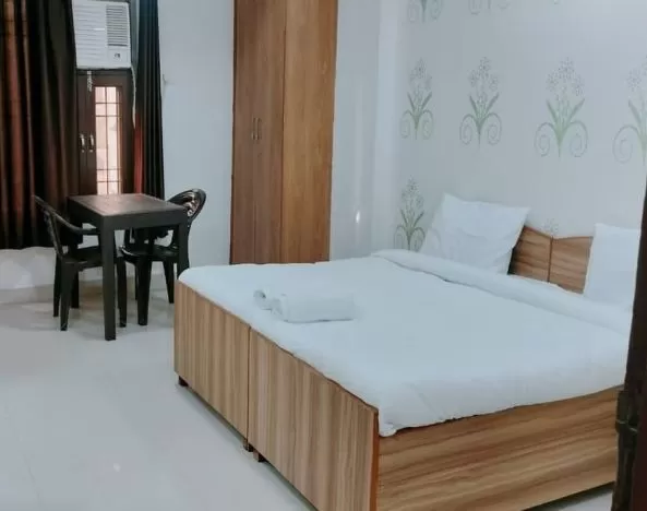 Comfortable king room with natural light at Hotel Urban Abode.