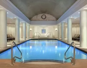 Stunning indoor pool with pool chairs at Hilton Short Hills.