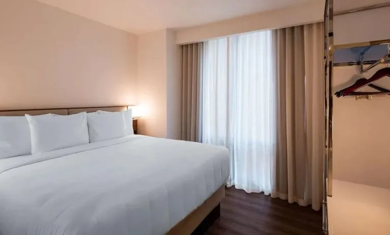 Delux king room with natural light at Best Western Premier Empire State Hotel.