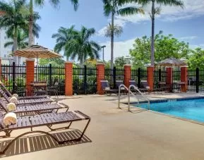 Sun loungers beside the pool at Hyatt PLACE Fort Lauderdale Airport - South & Cruise Port.