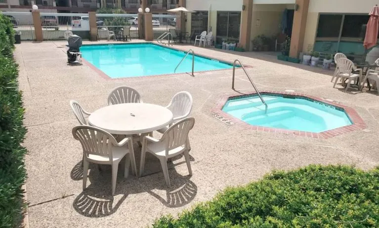 Refreshing outdoor pool at Coratel Inn & Suites By Jasper New Braunfels IH-35 EXT 189.