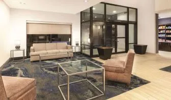 Lobby and coworking lounge at La Quinta Inn & Suites By Wyndham Philadelphia Airport.
