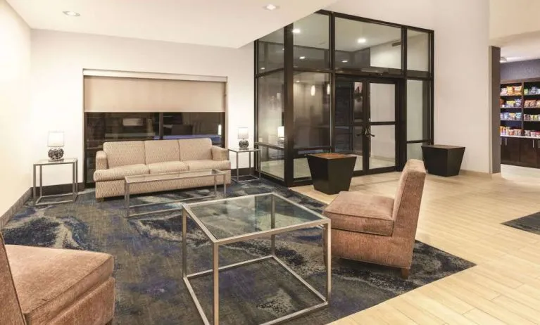 Lobby and coworking lounge at La Quinta Inn & Suites By Wyndham Philadelphia Airport.
