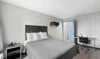 Day use room with work desk and natural light at Hotel 365 Bronx.