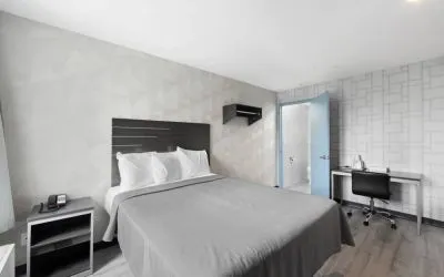 Day use room with work desk and natural light at Hotel 365 Bronx.