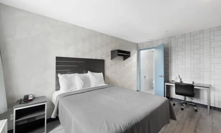Day use room with work desk and natural light at Hotel 365 Bronx.