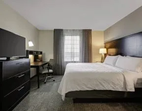 King bed with TV at Staybridge Suites Washington D.C.- Greenbelt.