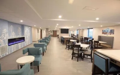 Dining area and coworking space at Sleep Inn Oakbrook Terrace.