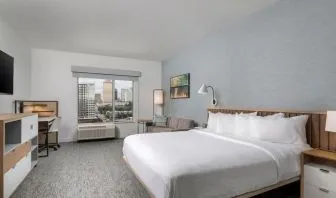 Day use room with work desk and sofa at TownePlace Suites Nashville Midtown.