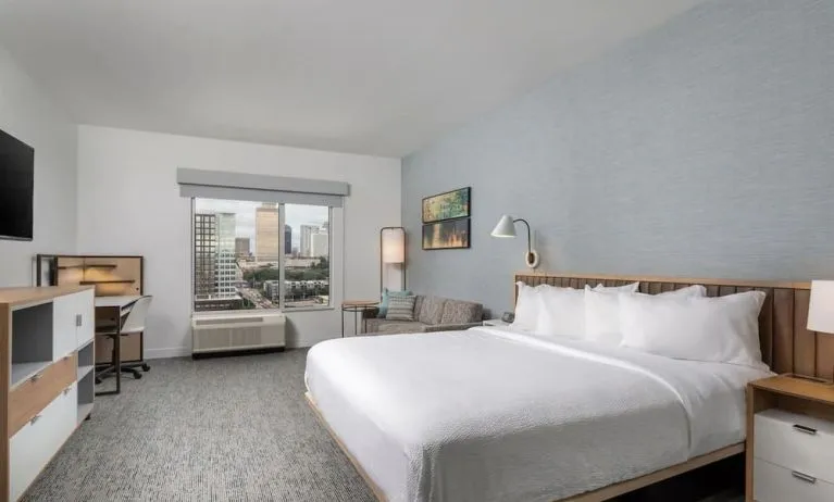 Day use room with work desk and sofa at TownePlace Suites Nashville Midtown.