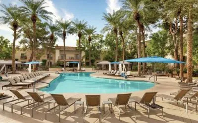 Stunning outdoor pool with sun beds at Hilton Scottsdale Resort & Villas.