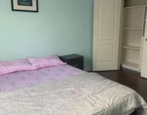 Delux king room with natural light at Home Stay Canada.