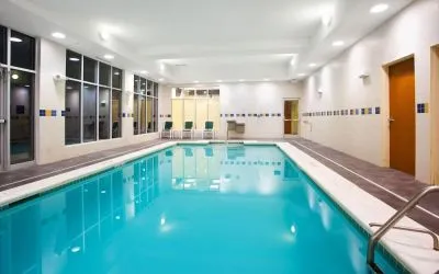 Relaxing indoor pool with seating area at Holiday Inn Aurora North- Naperville.