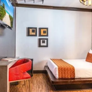 Delux king room with TV at Hotel Chelsea, A South Beach Group Hotel.