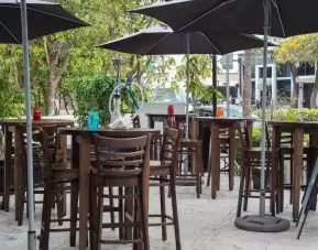 Hotel terrace with seating area at Hotel Chelsea, A South Beach Group Hotel.