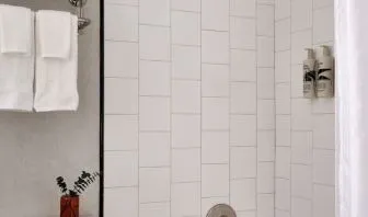 Private guest bathroom with shower at Romer Hell's Kitchen.