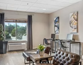 Business center with PC, internet, and printer at OYO Townhouse Orlando West.