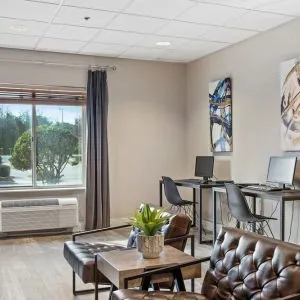 Business center with PC, internet, and printer at OYO Townhouse Orlando West.