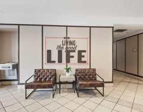 Lobby and coworking space at OYO Townhouse Orlando West.