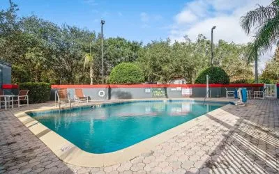 Relaxing outdoor pool at OYO Townhouse Orlando West.