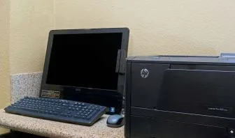 Business center with computer and printer at Travelodge LAX By Wyndham.