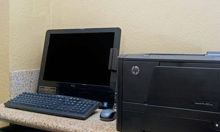 Business center with computer and printer at Travelodge LAX By Wyndham.