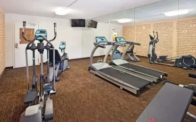 Fitness center at Norwood Inn Statefare Grounds.