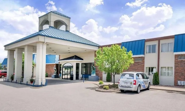 Hotel exterior and parking area at Norwood Inn & Suites La Crosse.