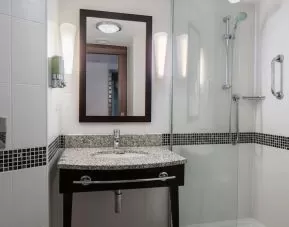 Guest bathroom with shower at Hampton By Hilton Birmingham Broad Street.