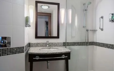 Guest bathroom with shower at Hampton By Hilton Birmingham Broad Street.