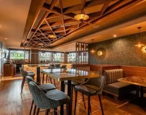 Dining area with comfortable seating at DoubleTree By Hilton Newcastle International Airport.